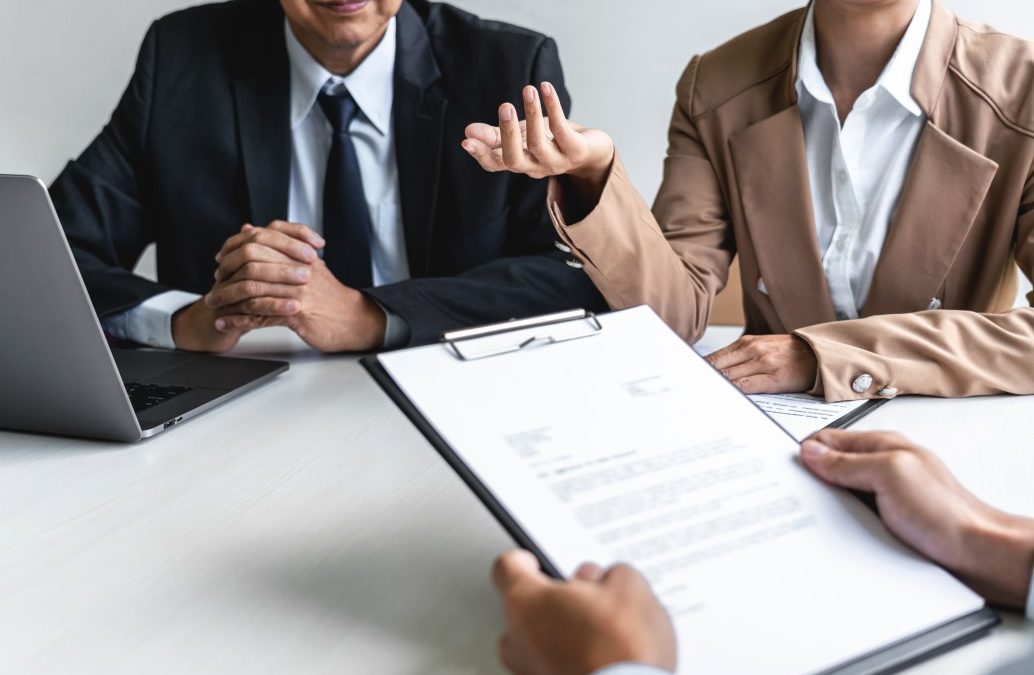 individuals discussing tax strategies with their tax advisor